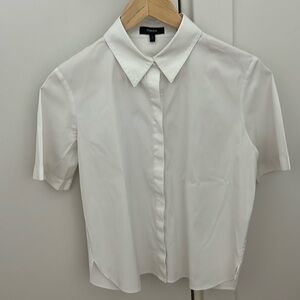White button-down shirt.